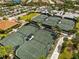 Aerial view of four well-maintained tennis courts at 12710 Sorrento Way # 101, Bradenton, FL 34211