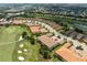 Aerial view showing community layout and villas near golf course at 12710 Sorrento Way # 101, Bradenton, FL 34211