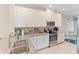 Modern kitchen with stainless steel appliances and granite countertops at 12710 Sorrento Way # 101, Bradenton, FL 34211