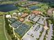 Aerial view of community amenities, including tennis courts and pool at 12710 Sorrento Way # 101, Bradenton, FL 34211