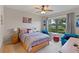 Charming bedroom with ample natural light and a view of the golf course at 12710 Sorrento Way # 101, Bradenton, FL 34211