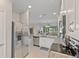 Open concept kitchen with stainless steel appliances and granite counters at 12710 Sorrento Way # 101, Bradenton, FL 34211