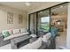 Relaxing lanai with outdoor seating and golf course views at 12710 Sorrento Way # 101, Bradenton, FL 34211