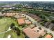 Aerial view of community villas adjacent to a golf course at 12710 Sorrento Way # 101, Bradenton, FL 34211