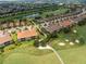 Aerial view of community villas located near golf course at 12710 Sorrento Way # 101, Bradenton, FL 34211