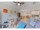 Open concept living area with home office and view to dining area at 12710 Sorrento Way # 101, Bradenton, FL 34211