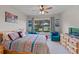 Large bedroom with a comfortable bed and plenty of natural light at 12710 Sorrento Way # 101, Bradenton, FL 34211
