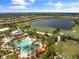 Resort-style pool and clubhouse with expansive green areas at 12710 Sorrento Way # 101, Bradenton, FL 34211