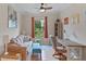 Bright living area with a comfortable sofa and a workspace at 12710 Sorrento Way # 101, Bradenton, FL 34211