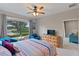 Bright bedroom with golf course view, comfy seating, and large bed at 12710 Sorrento Way # 101, Bradenton, FL 34211