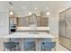 Gourmet kitchen with island, quartz countertops, and stainless steel appliances at 405 Maraviya Blvd, Nokomis, FL 34275