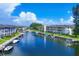 Waterfront view of the community with boats and lush landscaping at 4340 Falmouth Dr # 203, Longboat Key, FL 34228