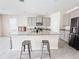 Beautiful kitchen with a large island, granite countertops and stainless steel appliances at 10827 Charlotte Dr, Parrish, FL 34219