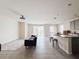 Open-concept living area with ceramic tile floors and a modern interior design at 10827 Charlotte Dr, Parrish, FL 34219
