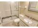Bathroom featuring glass-enclosed shower and single sink vanity with granite countertop at 19 Whispering Sands Dr # 204, Sarasota, FL 34242
