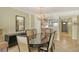 Bright dining area with an elegant chandelier and seating for six at 19 Whispering Sands Dr # 204, Sarasota, FL 34242