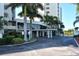 Beautiful building entrance featuring lush landscaping, and an upscale, well maintained entryway at 19 Whispering Sands Dr # 204, Sarasota, FL 34242