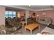 Comfortable lounge area with ocean view, tables, chairs, and neutral colors at 19 Whispering Sands Dr # 204, Sarasota, FL 34242