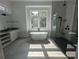 Spa-like bathroom with freestanding tub, walk-in shower, and large window at 4819 Higel Rd, Sarasota, FL 34242