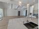 Modern kitchen island with marble countertop and stainless steel sink at 4819 Higel Rd, Sarasota, FL 34242