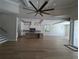 Open concept living room with hardwood floors and a view of the kitchen at 4819 Higel Rd, Sarasota, FL 34242
