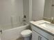 Bathroom features a bathtub and shower combination and a granite-topped vanity at 4865 Manila Ave, North Port, FL 34288