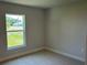 A bright and spacious carpeted bedroom with a large window at 4865 Manila Ave, North Port, FL 34288