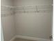 Walk in closet features carpeted floor and shelf for maximum storage space at 4865 Manila Ave, North Port, FL 34288