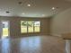 A bright and airy living room with a large window and ceramic tile floors at 4865 Manila Ave, North Port, FL 34288