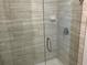 New bathroom shower features tile surround and glass door at 4865 Manila Ave, North Port, FL 34288