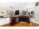 Island kitchen features granite countertops and stainless steel appliances at 17812 Doe Creek Ct, Parrish, FL 34219