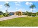 Stunning curb appeal with a circular driveway, fountain and palm trees at 17812 Doe Creek Ct, Parrish, FL 34219