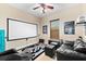 Home theater room with projector and comfortable seating at 17812 Doe Creek Ct, Parrish, FL 34219