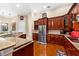 Spacious kitchen with granite countertops, stainless steel appliances, and rich wood cabinetry at 17812 Doe Creek Ct, Parrish, FL 34219