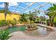 Expansive screened pool with tropical landscaping at 17812 Doe Creek Ct, Parrish, FL 34219