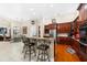 Kitchen with stainless steel appliances and dark wood cabinets at 17812 Doe Creek Ct, Parrish, FL 34219