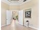 Elegant hallway with tile floors and access to other rooms at 17812 Doe Creek Ct, Parrish, FL 34219