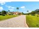 Impressive two-story home with a paved driveway and lush landscaping at 17812 Doe Creek Ct, Parrish, FL 34219