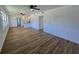 Bright living room with hardwood floors and ceiling fans at 100 N Duncan Ave, Clearwater, FL 33755