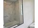 Modern bathroom with marble tile and a large mirror at 100 N Duncan Ave, Clearwater, FL 33755