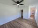 Spacious bedroom with hardwood floors and access to hallway at 100 N Duncan Ave, Clearwater, FL 33755