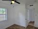 Bright bedroom with wood-look floors, ceiling fan and access to bathroom at 100 N Duncan Ave, Clearwater, FL 33755