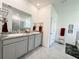 Double vanity bathroom with granite countertops at 10827 Charlotte Dr, Parrish, FL 34219