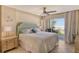 Main bedroom with ocean view and sliding glass door to balcony at 19 Whispering Sands Dr # 204, Sarasota, FL 34242