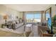 Living room with ocean view and comfy seating at 19 Whispering Sands Dr # 204, Sarasota, FL 34242
