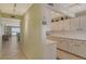 Condo entryway with view into living area and kitchen at 19 Whispering Sands Dr # 204, Sarasota, FL 34242