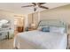 King-size bed in bedroom with ensuite bathroom access at 19 Whispering Sands Dr # 204, Sarasota, FL 34242