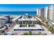 Aerial view of beachfront property with ocean and building details at 2100 Benjamin Franklin Dr # 105, Sarasota, FL 34236