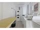 Shared laundry facility with several washers and dryers at 2100 Benjamin Franklin Dr # 105, Sarasota, FL 34236