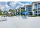 Lido Harbour South patio area with tables, chairs, and lounge chairs at 2100 Benjamin Franklin Dr # 105, Sarasota, FL 34236